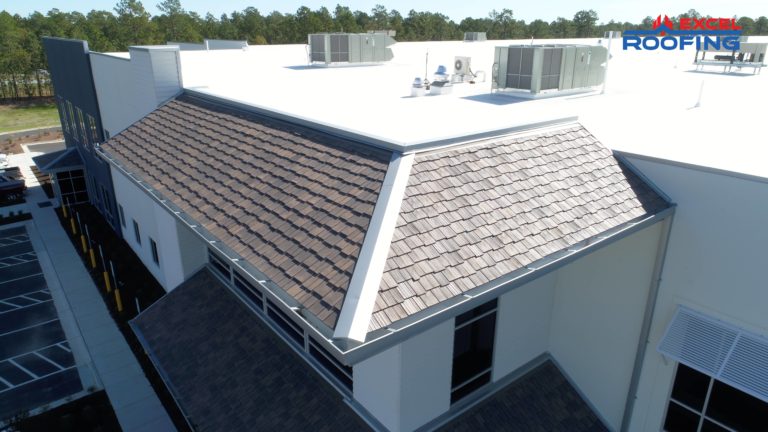 White TPO roof with DaVinci Shakes on a warehouse in Wilmington, NC.