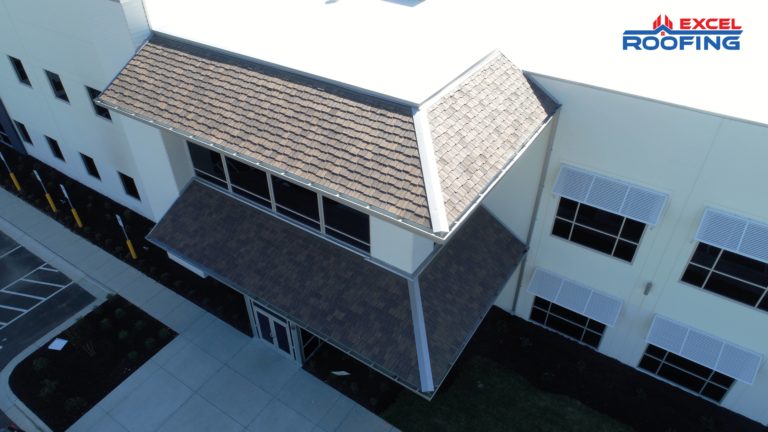 White TPO roof with DaVinci Shakes over the front entrance on a large warehouse in Wilmington, NC.
