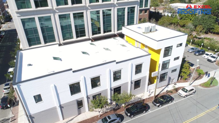 Aerial view of white TPO roof replacement in Wilmington, NC.