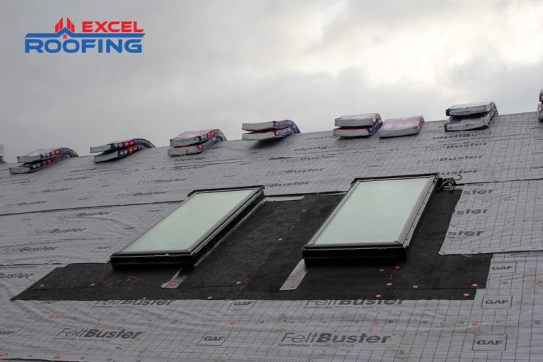 In-progress installation of architectural shingles and Velux skylights in Wilmington, NC.