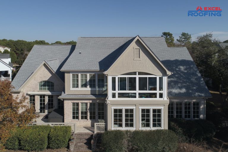 Shingle roof replacement on house with large windows in Wilmington, NC.
