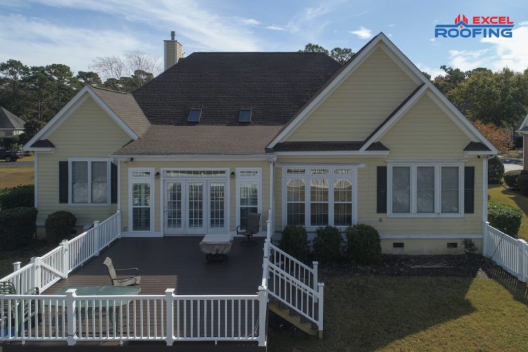 Ranch-style house with black architectural shingle roof and two skylights in Wilmington, NC.