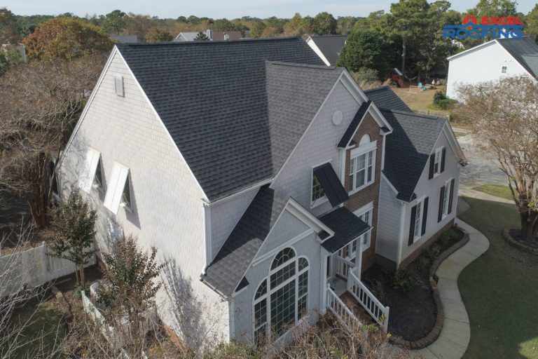 Black architectural shingle roof on a two-story house in Wilmington, NC.