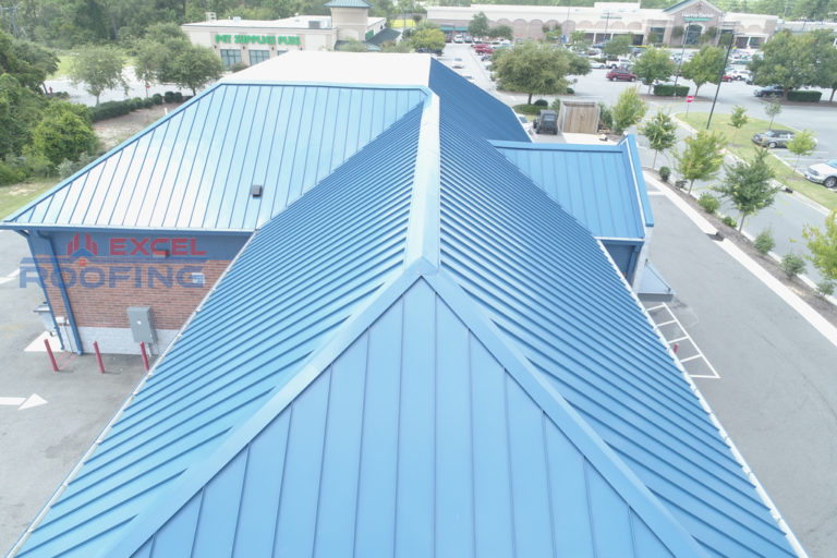 Metal roof and flat TPO roof installed on a commercial building in Wilmington, NC.