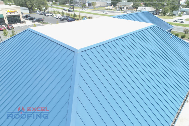 Metal roof and flat TPO roof on a commercial building in Wilmington, NC.