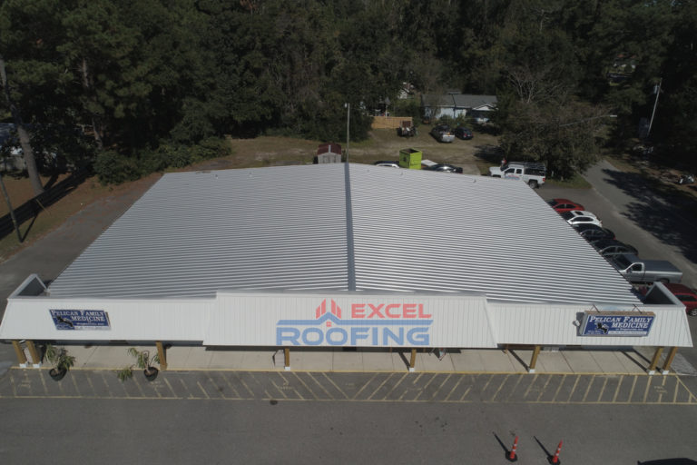 Metal roof replaced on an office building in Wilmington, NC, by Excel Roofing Company.