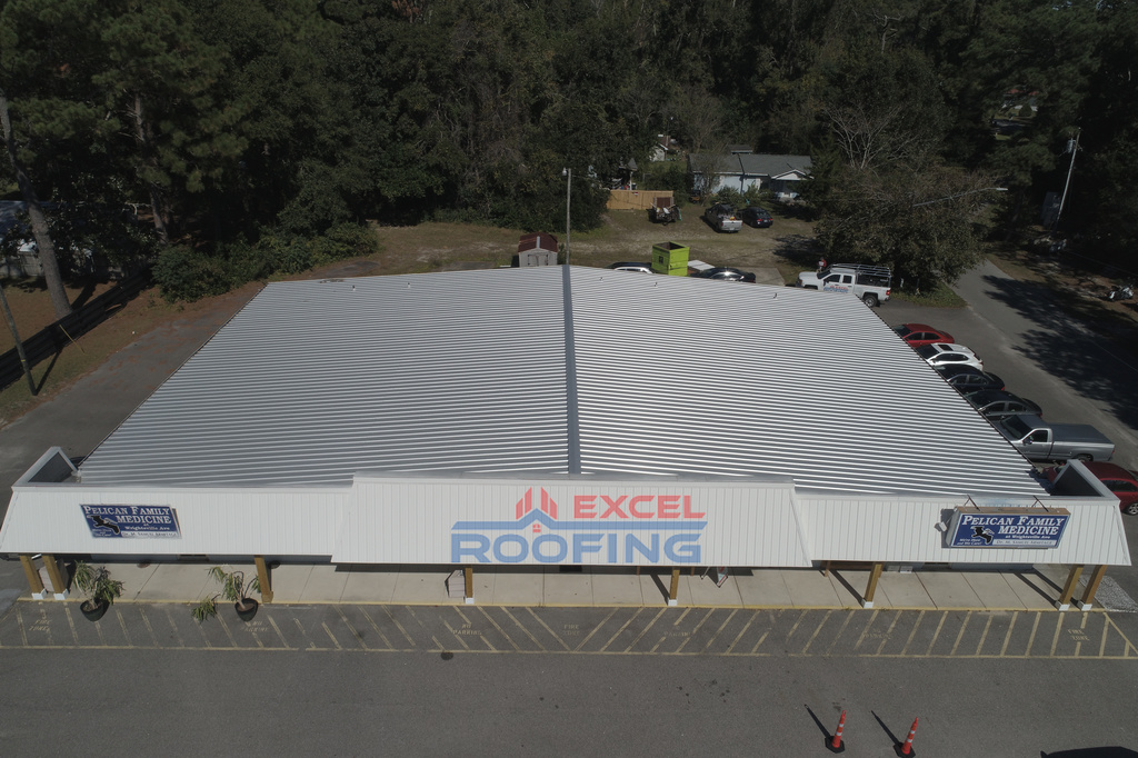 Metal roof replaced on an office building in Wilmington, NC, by Excel Roofing Company.