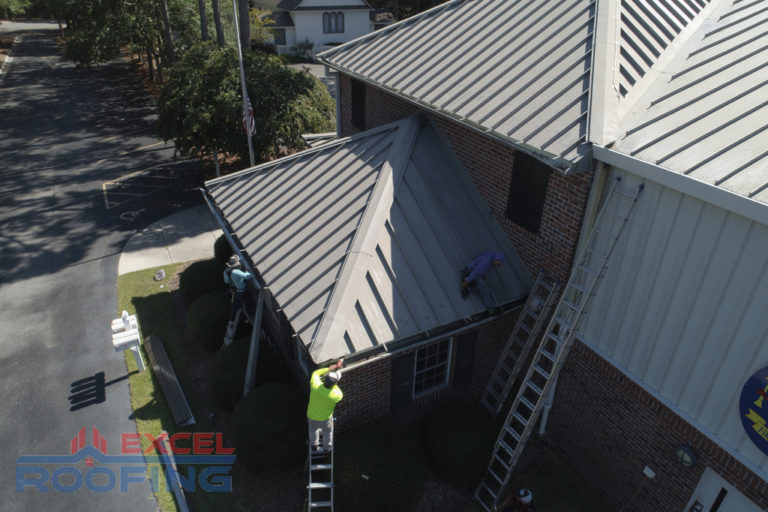 Commercial metal roof installed by Excel Roofing Company on the fire station in St. James, Southport, NC, showcasing durable and weather-resistant materials.