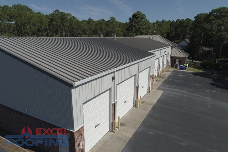 Commercial metal roof installed by Excel Roofing Company on the fire station in St. James, Southport, NC, featuring weather resistance and durable craftsmanship.