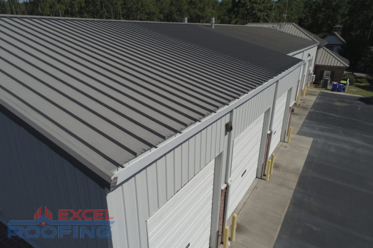 Commercial metal roof installed by Excel Roofing Company on the fire station in St. James, Southport, NC, showcasing coastal durability and modern design.