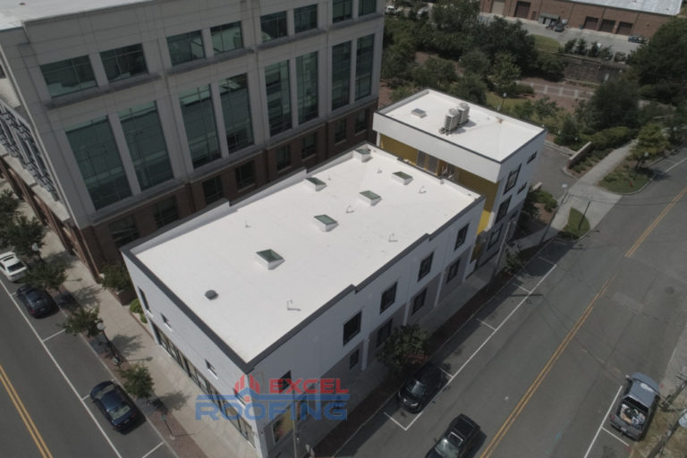 Apartment building in Wilmington, NC, with a new flat TPO roof installed.