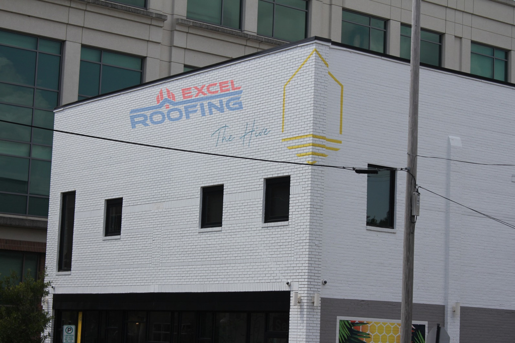 Front view of an apartment building in Wilmington, NC, with a new TPO roof installed.