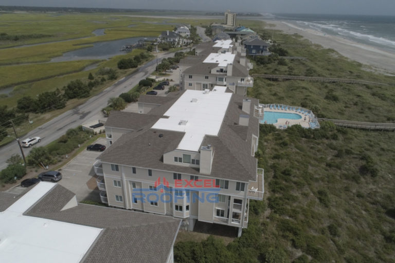 Luxury condos at Wrightsville Beach, NC, with new shingle and TPO roofs installed by Excel Roofing Company.