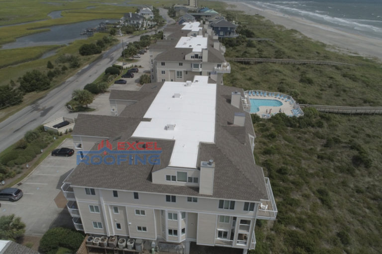 Luxury condos at Wrightsville Beach, NC, with new shingle and TPO roofs installed.