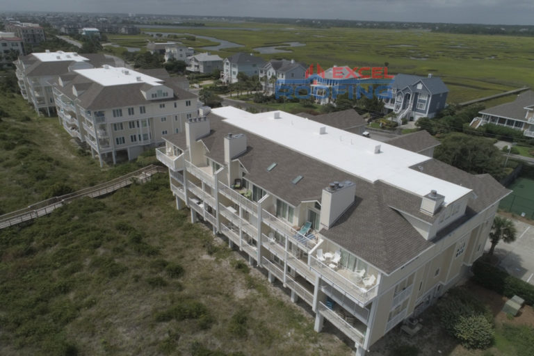 Luxury condo buildings in Wrightsville Beach, NC, with new shingle and TPO roofs installed by Excel Roofing Company.