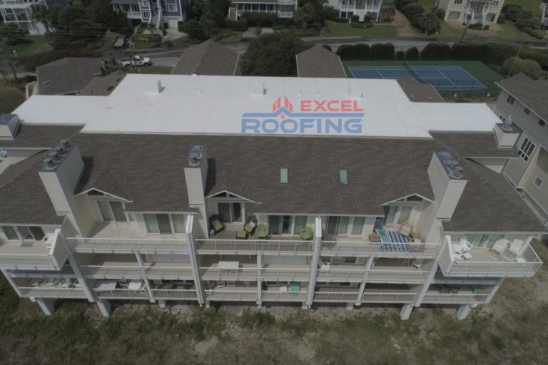 Luxury condos in Wrightsville Beach, NC, with new shingle and TPO roofs by Excel Roofing Company.