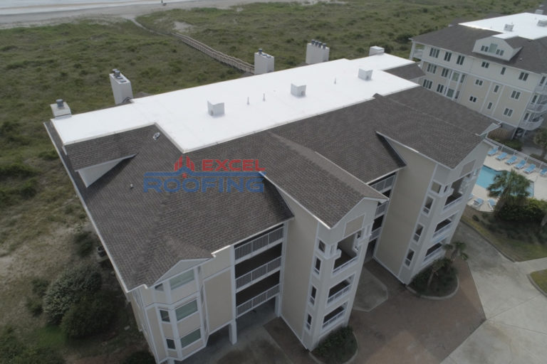 Luxury condos in Wrightsville Beach, NC, with new shingle and TPO roofs installed by Excel Roofing Company.