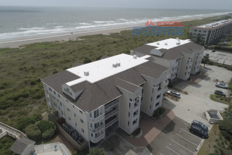 Luxury condos in Wrightsville Beach, NC, with new shingle and TPO roofs installed by Excel Roofing Company.