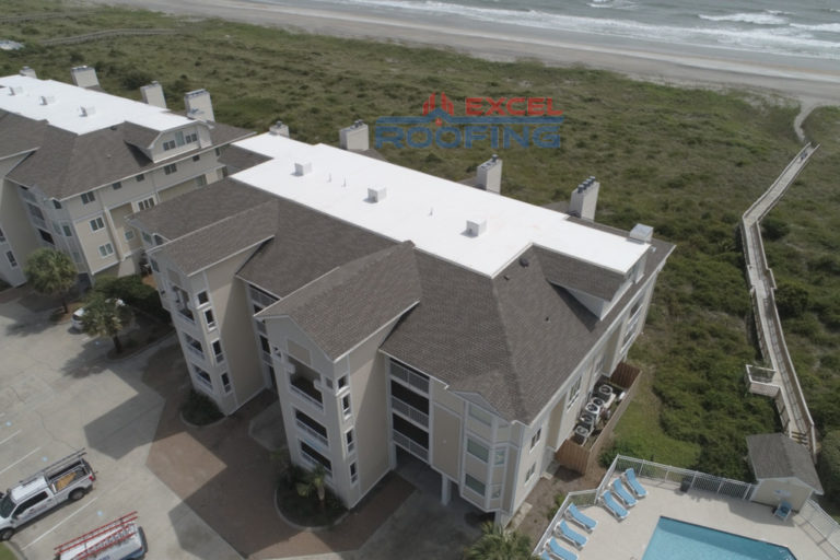 Luxury condos in Wrightsville Beach, NC, with new shingle and TPO roofs installed.