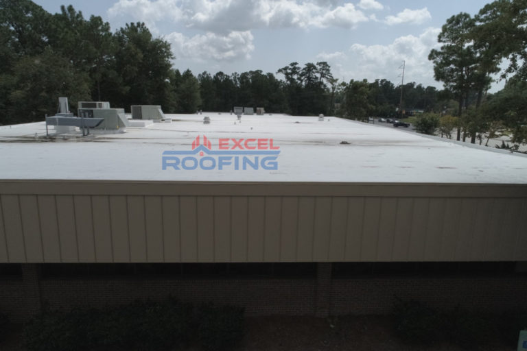 Flat TPO roof with new insulation and metal roof on a community center in Wilmington, NC.