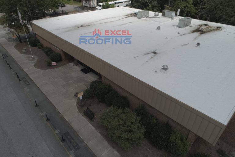 Flat TPO roof and metal roof installation on a community center in Wilmington, NC.