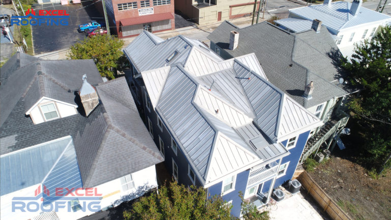 Zinc-coated copper metal roof installed by Excel Roofing in downtown Wilmington, NC, featuring durable materials and an elegant design.