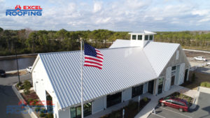 Standing seam metal roof installed by Excel Roofing over a shopping center in Wilmington, NC, featuring durability and modern craftsmanship.