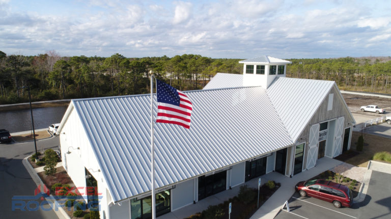 Standing seam metal roof installed by Excel Roofing over a shopping center in Wilmington, NC, highlighting durable materials and modern design.