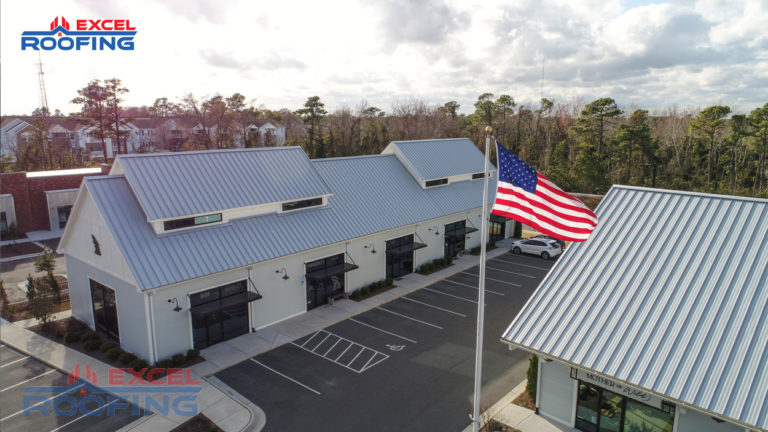Standing seam metal roof installed by Excel Roofing over a commercial shopping center in Wilmington, NC, featuring durable materials and sleek design.